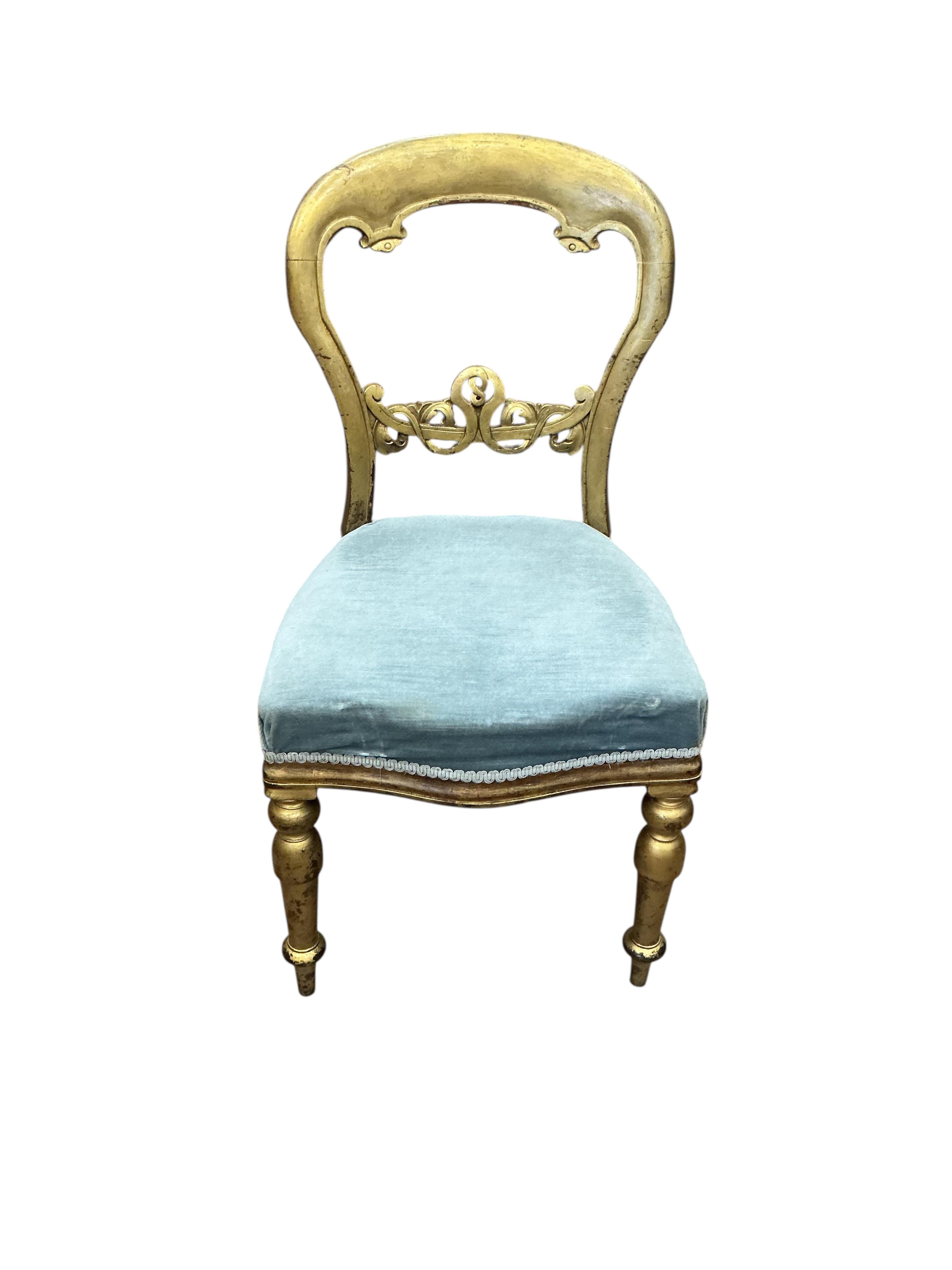 A William IV and later segmental mahogany veneer, parcel gilt circular tilt top breakfast table, diameter 120cm, height 72cm and a harlequin set of six later painted balloon back chairs